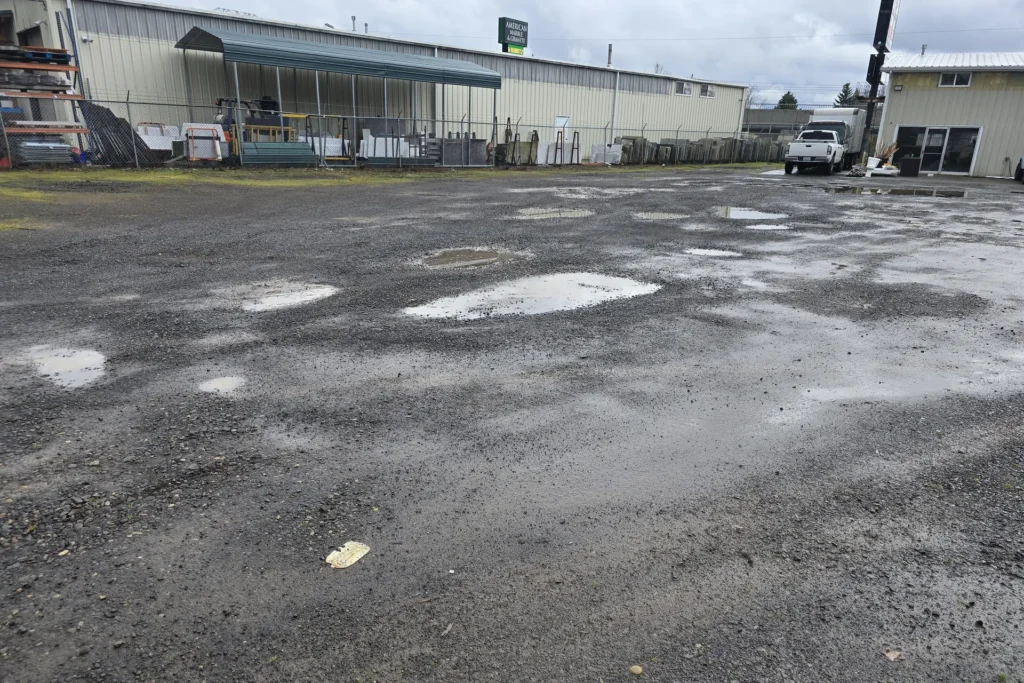 a dirt road with potholes