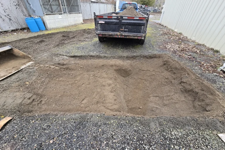 The trailer will load gravel to level the area.